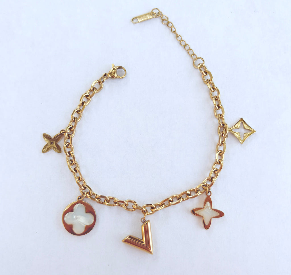 Bracelet breloques étoiles et trèfle nacré doré - vue 1