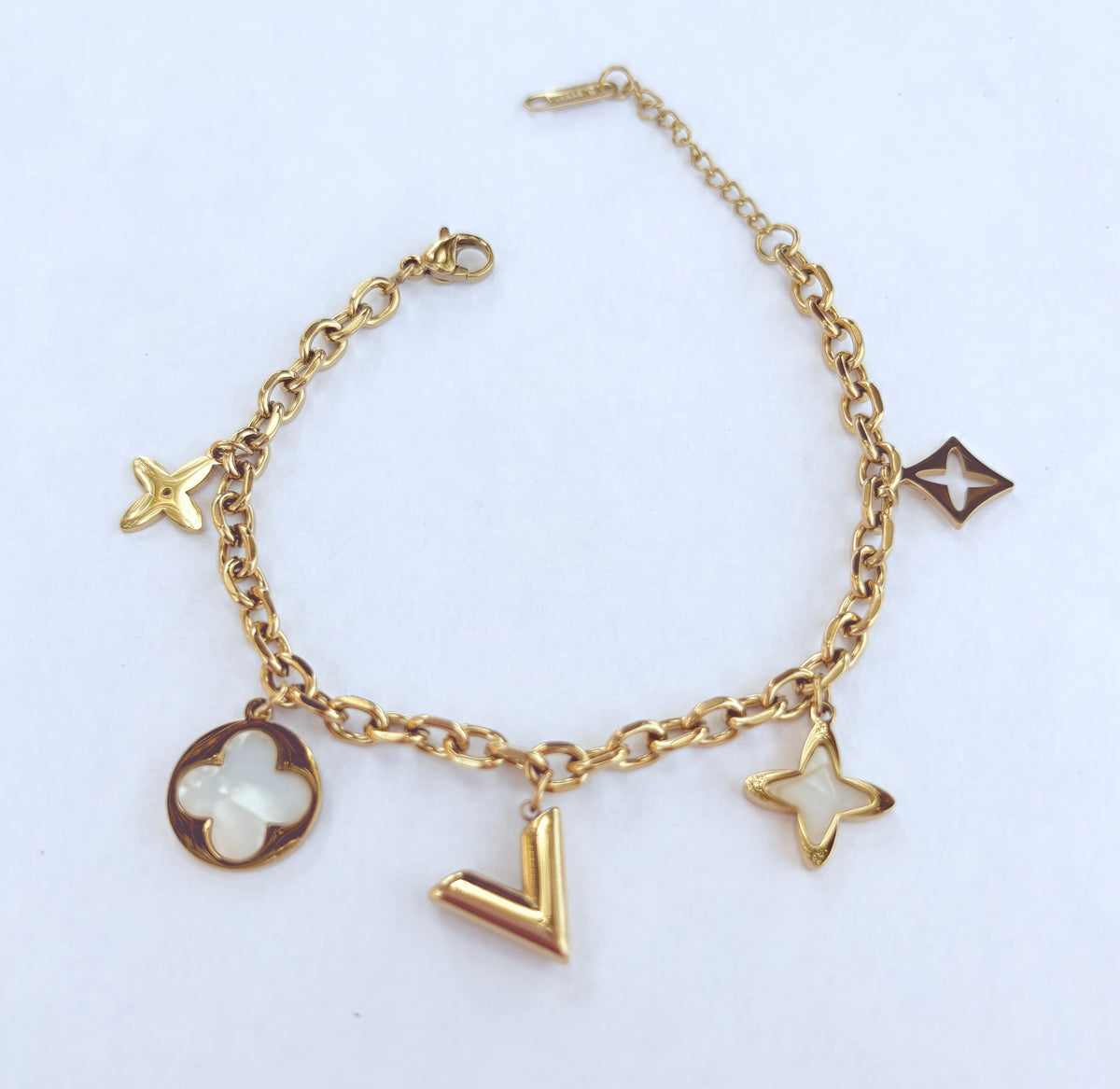 Bracelet breloques étoiles et trèfle nacré doré - vue 2