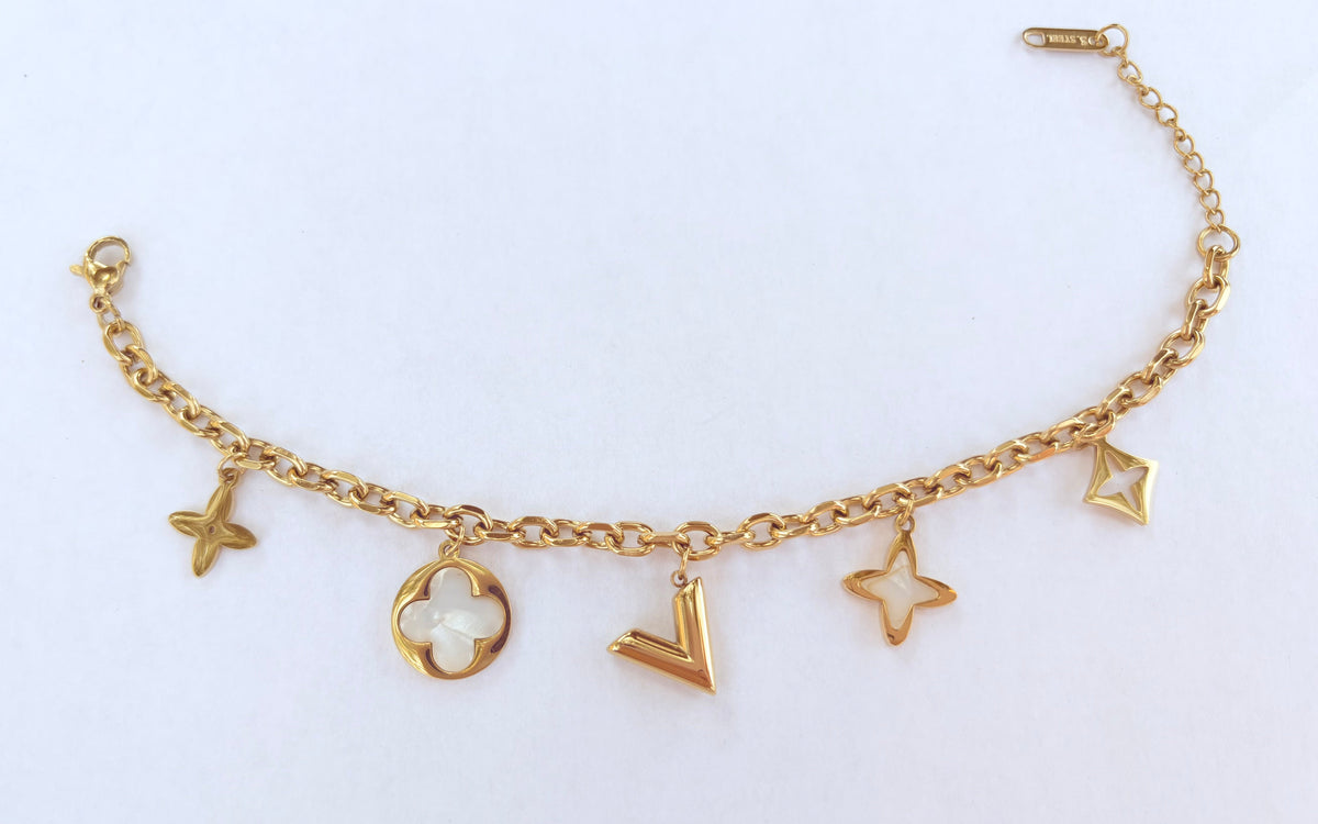 Bracelet breloques étoiles et trèfle nacré doré - vue 3