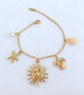 Bracelet breloques soleil étoile de mer et tortue - vue 1