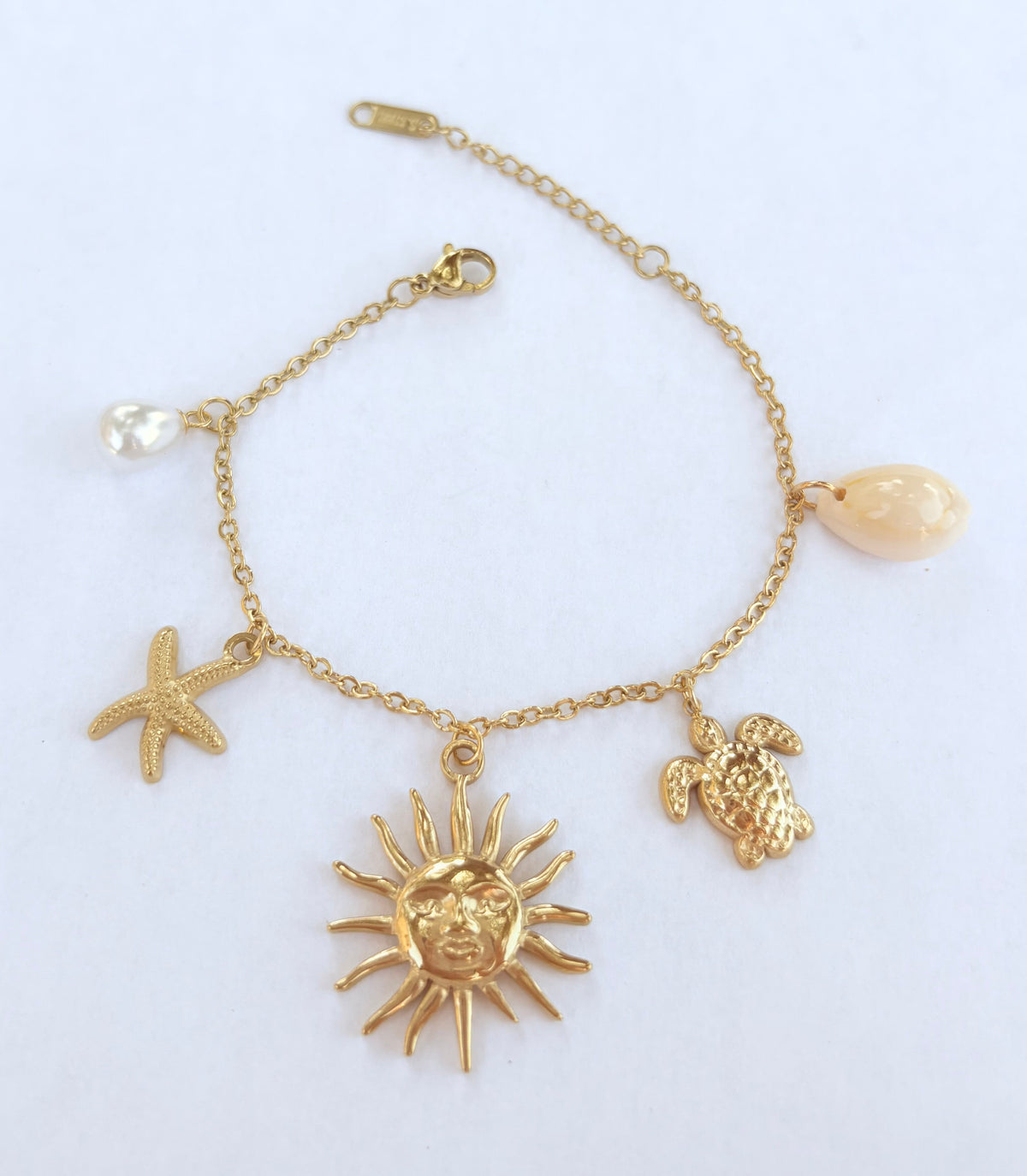 Bracelet breloques soleil étoile de mer et tortue - vue 1